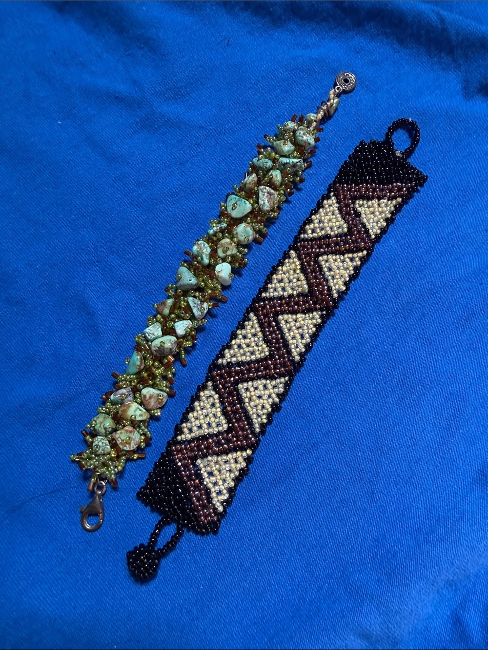Artisan made two sparkly seed bead bracelets.